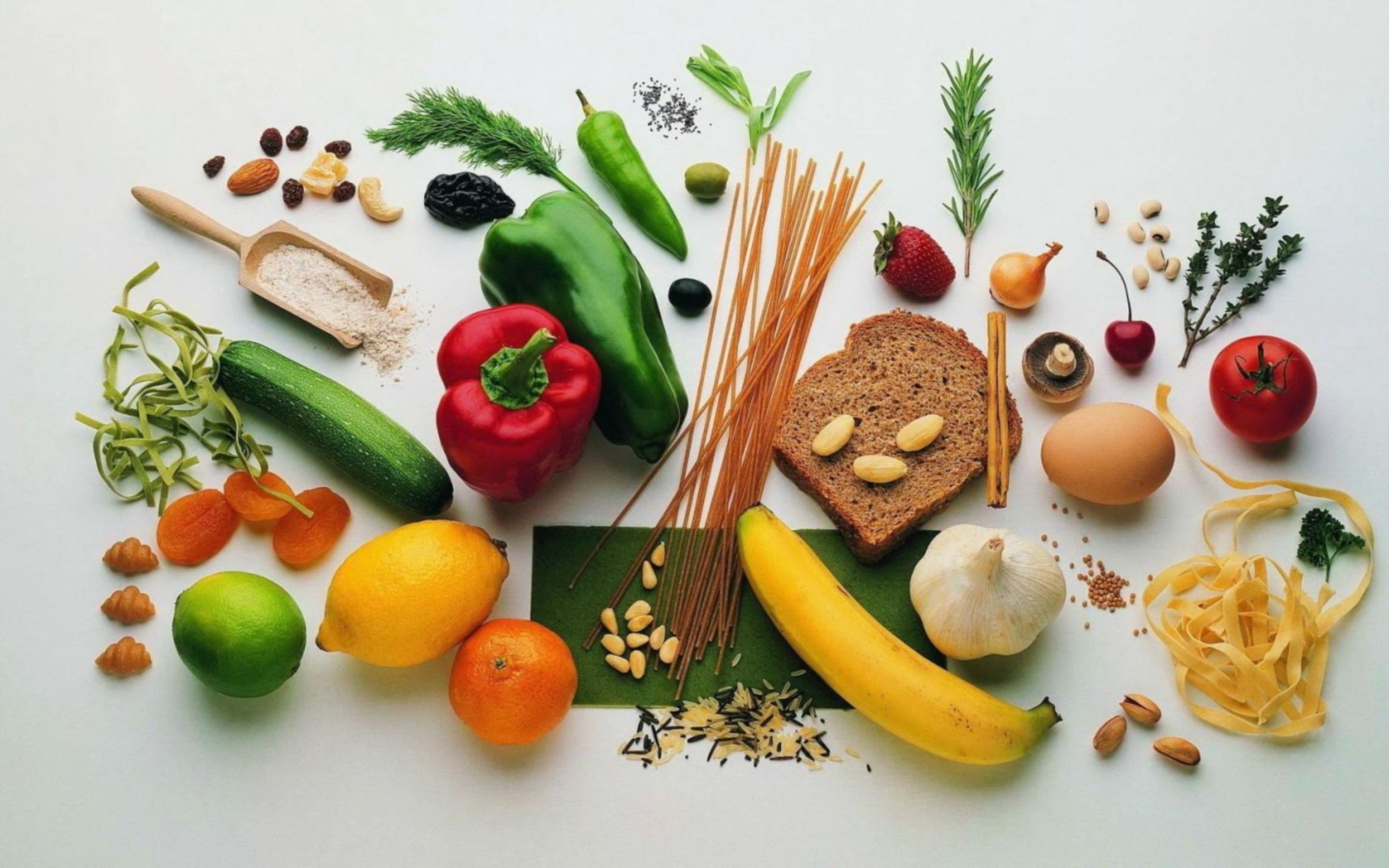 Assorted vegetables and foods on orange background